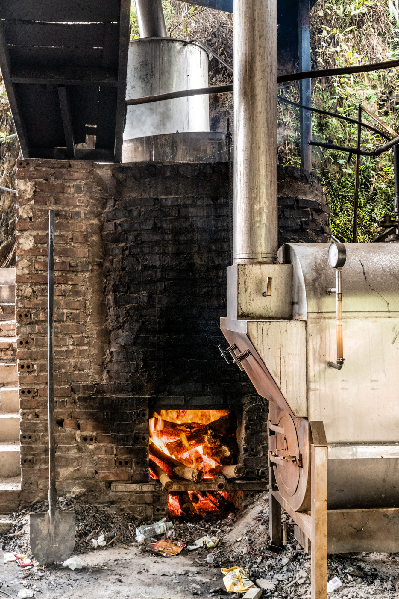 Fire burning beneath a metal boiler
